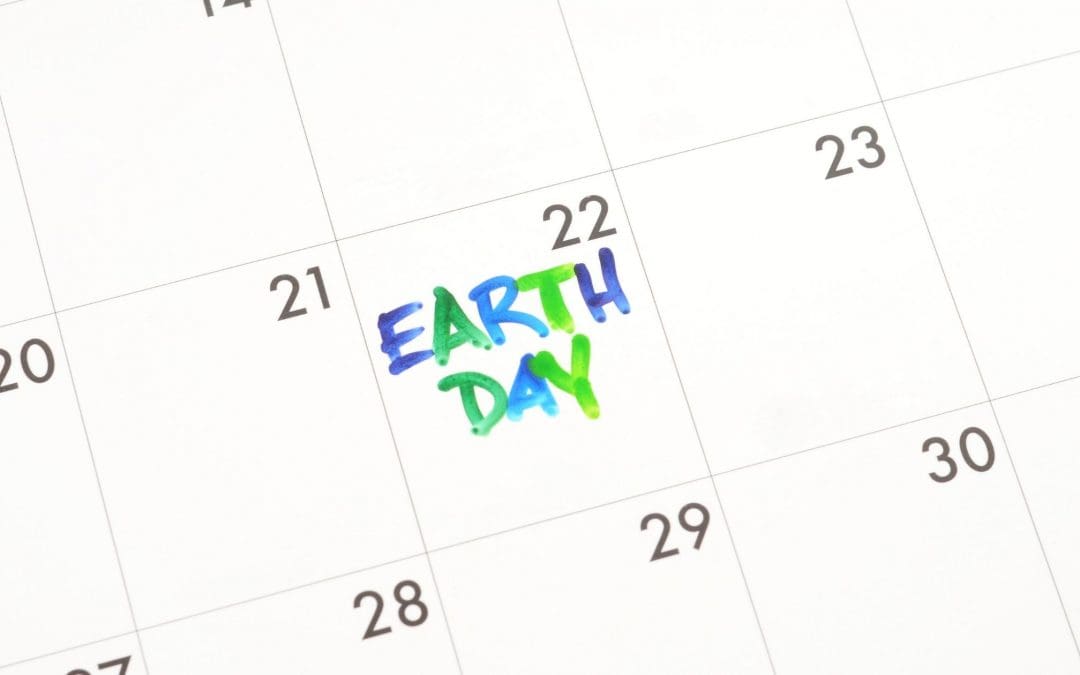 generic photo of earth day written on a calendar